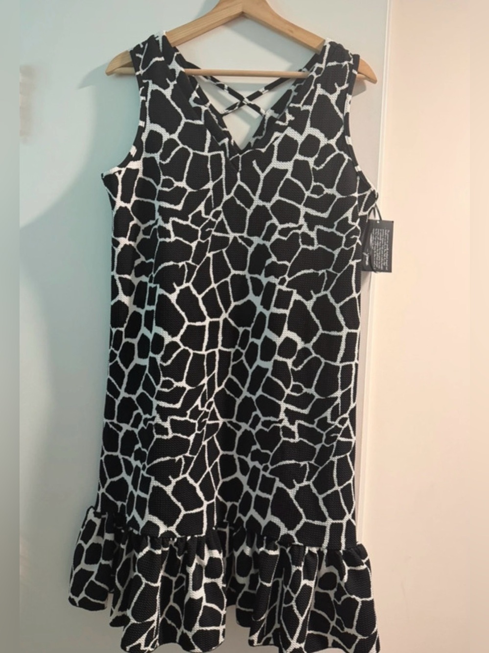 Sleeveless Black and White Giraffe-Print Midi Dress with Ruffle Hem